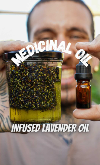Alessandro Vitale aka Spicy Moustache holding a jar of medicinal oil infused lavender oil